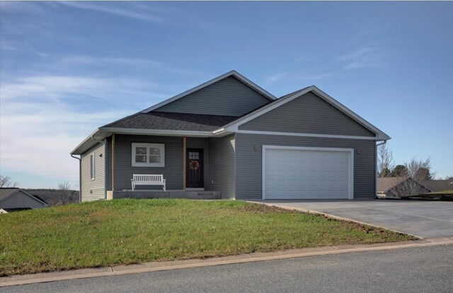 view of front of home with a garage and a front yard