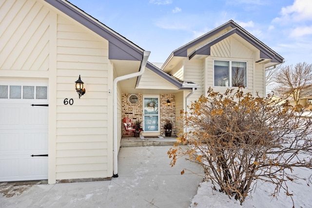 doorway to property featuring a garage