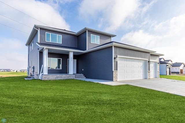 view of front facade with a garage and a front yard