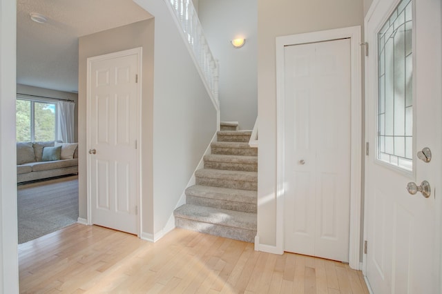 staircase featuring hardwood / wood-style floors