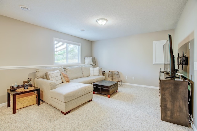 living room with light carpet and a textured ceiling