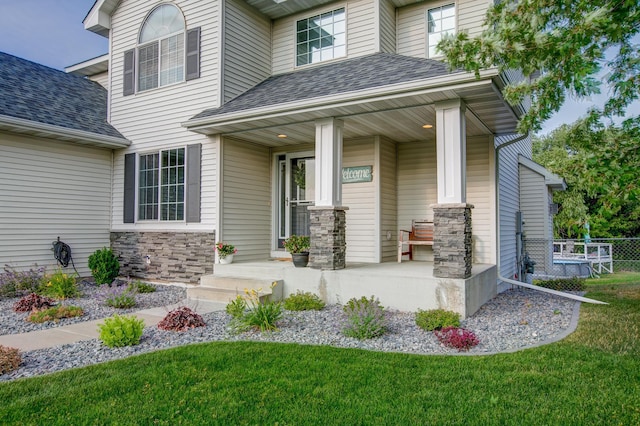 entrance to property featuring a porch