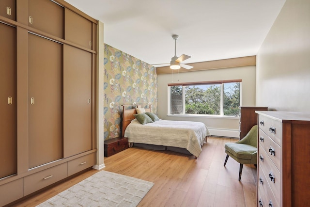 bedroom featuring a closet, ceiling fan, and light hardwood / wood-style flooring