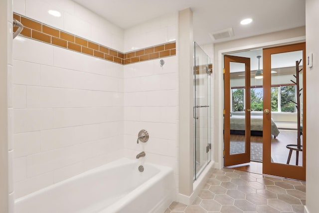 bathroom featuring tile patterned flooring, separate shower and tub, and french doors