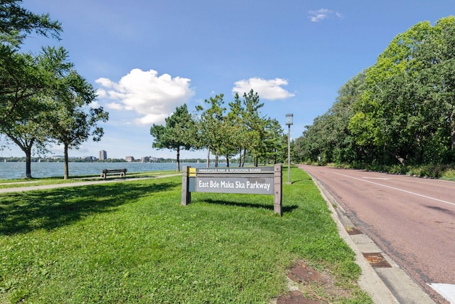 exterior space with a yard and a water view