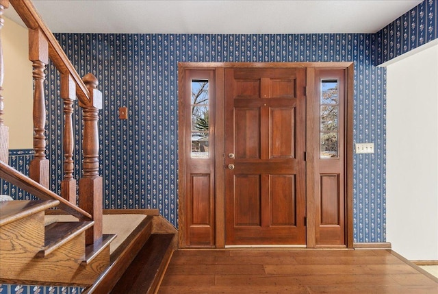 entryway with hardwood / wood-style flooring