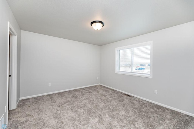 spare room with light carpet