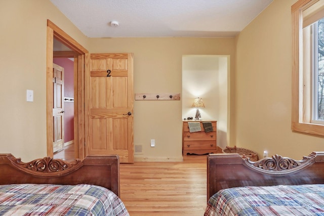 bedroom with light hardwood / wood-style flooring