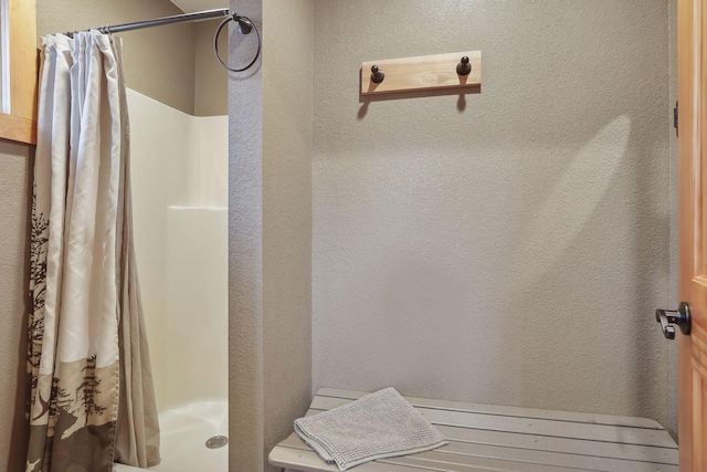 bathroom featuring curtained shower