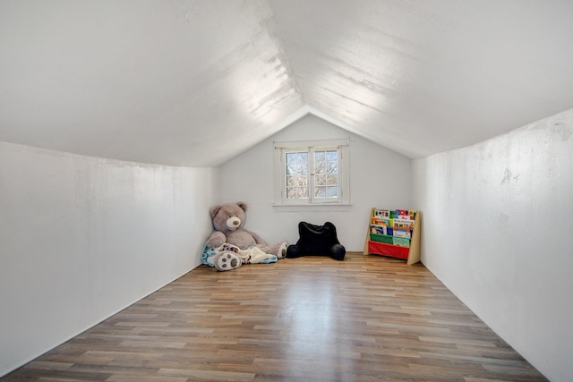 game room featuring vaulted ceiling and wood finished floors