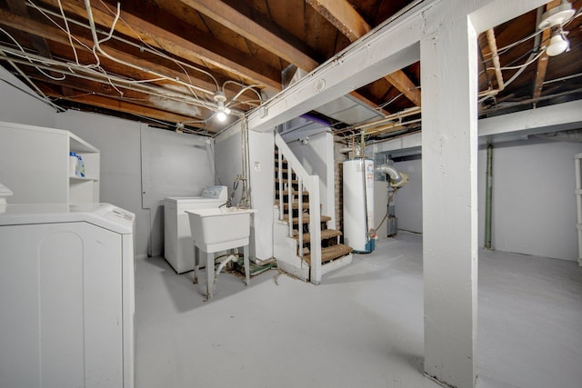 unfinished basement with washing machine and dryer, water heater, stairway, and a sink