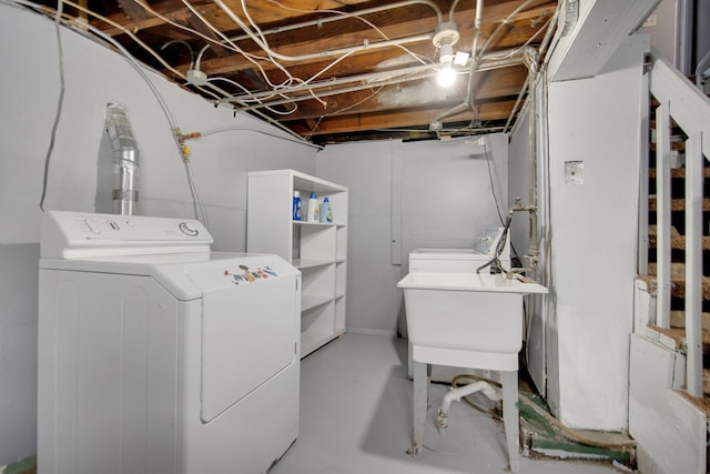 clothes washing area with washer and dryer