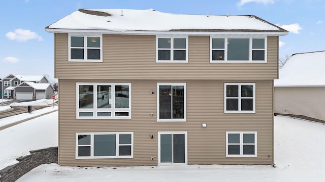 view of snow covered house