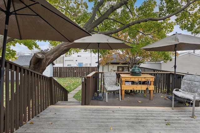 wooden terrace with a storage unit