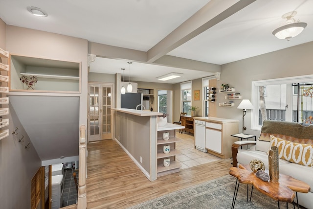 living room with french doors and light hardwood / wood-style flooring