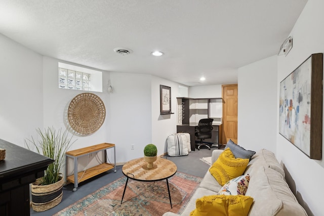 living room featuring a textured ceiling