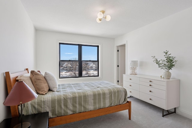 carpeted bedroom with baseboards