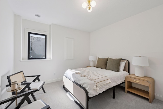 bedroom featuring baseboards and light colored carpet