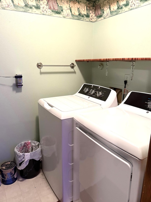 2402 Kenwood Dr SW, Willmar, MN 56201 - laundry room featuring washing machine and dryer and light tile patterned flooring
