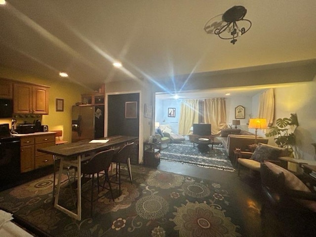 dining room with vaulted ceiling