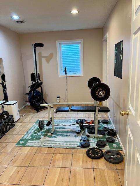 workout area with tile patterned flooring