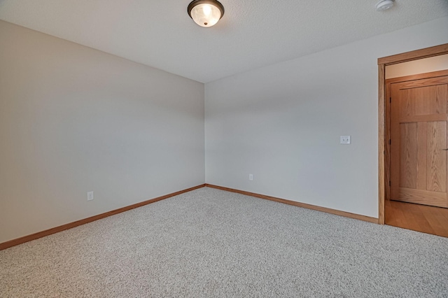 unfurnished room featuring carpet flooring