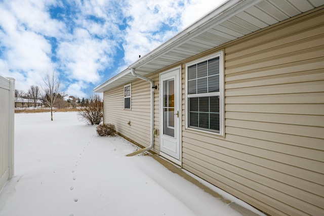 view of snow covered property entrance