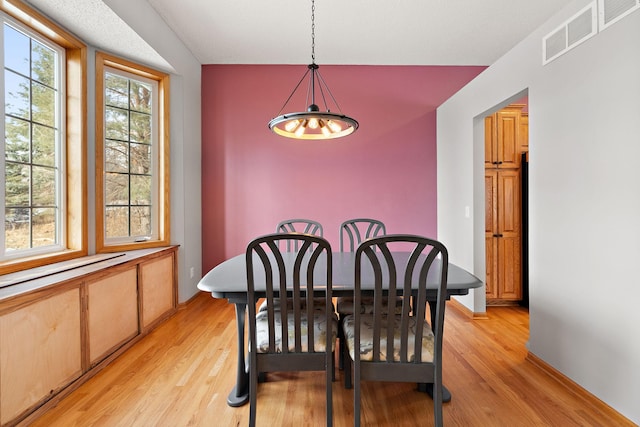 dining area featuring light hardwood / wood-style floors