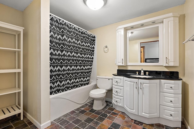 full bathroom featuring toilet, vanity, and shower / tub combo with curtain