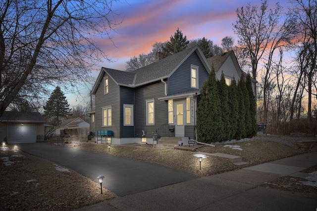 view of front of house featuring an outbuilding and a garage