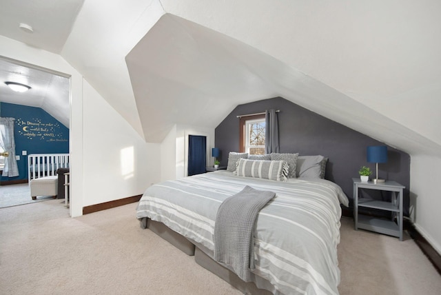 bedroom featuring access to exterior, light carpet, and vaulted ceiling