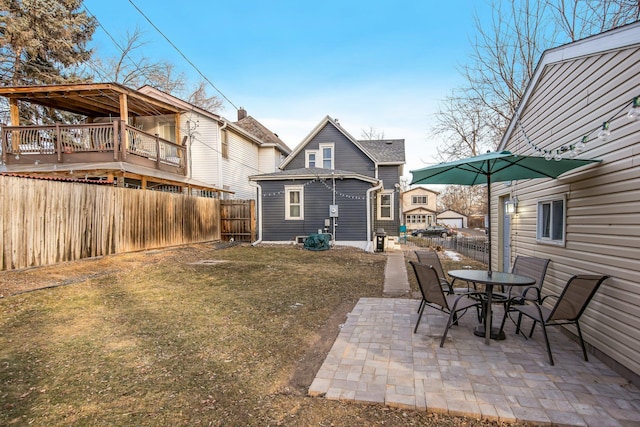 exterior space with a yard, a patio, and a wooden deck