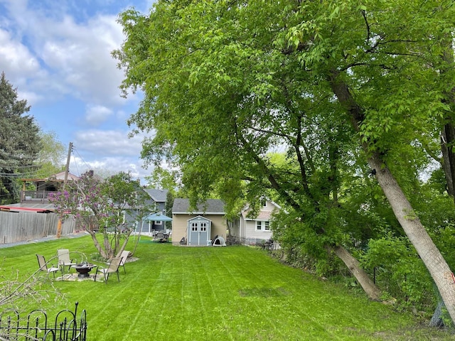 view of yard with a fire pit