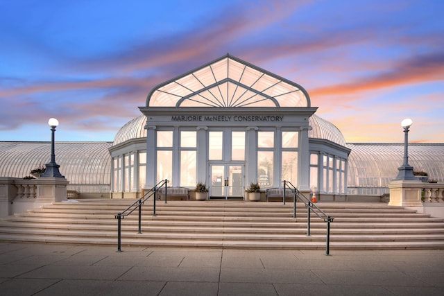 view of outdoor building at dusk