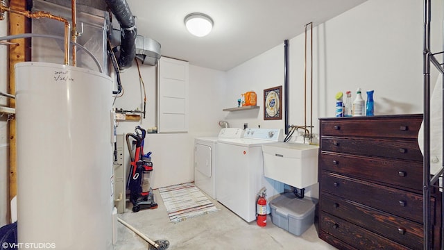 laundry room with sink, separate washer and dryer, and water heater