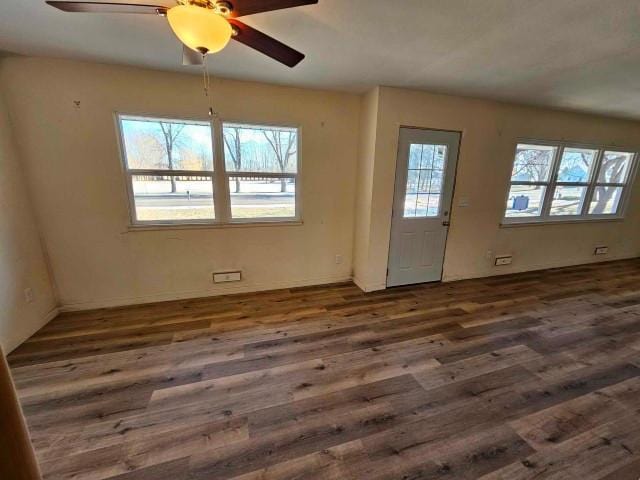 interior space featuring dark hardwood / wood-style floors and ceiling fan