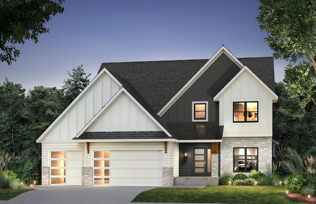 view of front of property with a lawn and a garage