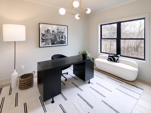 home office featuring a notable chandelier, ornamental molding, and baseboards