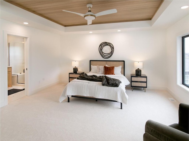 bedroom featuring light carpet, wood ceiling, and a tray ceiling