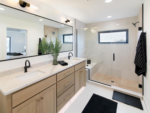 ensuite bathroom featuring double vanity, ensuite bath, a marble finish shower, and a sink