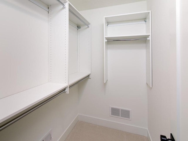 spacious closet featuring visible vents