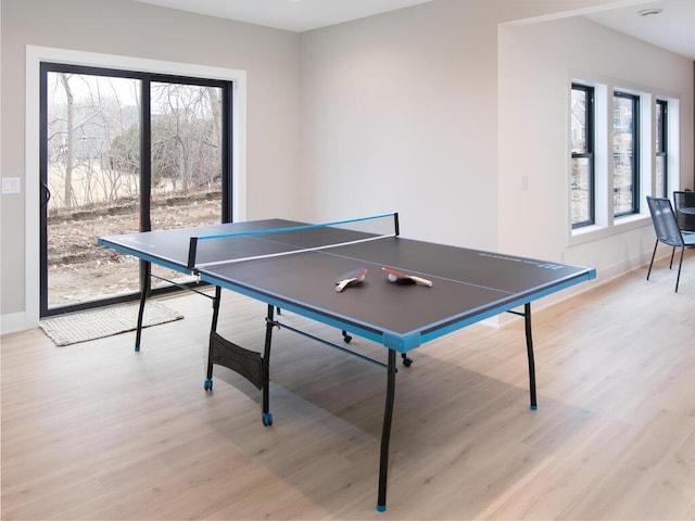 recreation room with light wood-style floors and baseboards