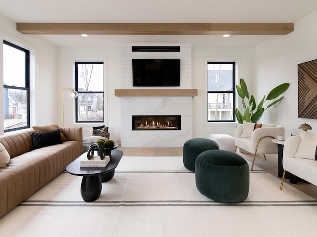 3447 Falcon Cir NW, Prior Lake, MN 55372 - living area with beamed ceiling, a premium fireplace, and recessed lighting
