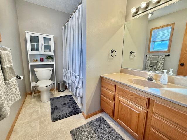 full bathroom with tile patterned flooring, baseboards, vanity, and toilet