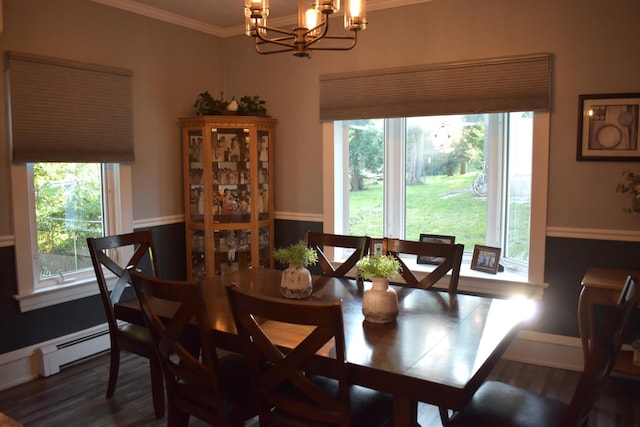 dining room with a chandelier, dark hardwood / wood-style flooring, a baseboard radiator, and ornamental molding