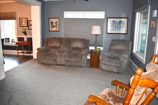 living room with carpet and a baseboard radiator