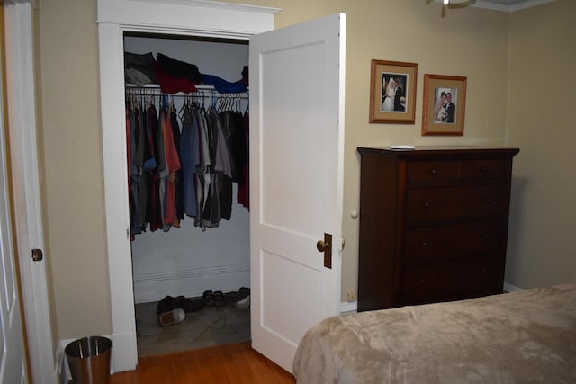 bedroom featuring light hardwood / wood-style floors and a closet