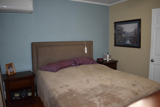 bedroom featuring a wall mounted AC and crown molding