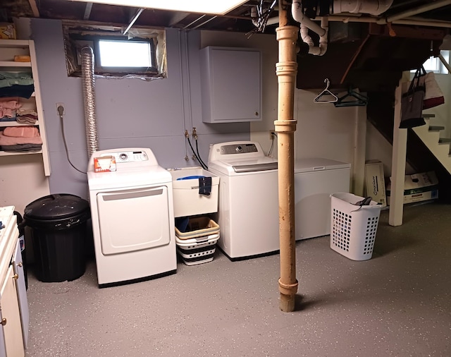 laundry area featuring independent washer and dryer and sink