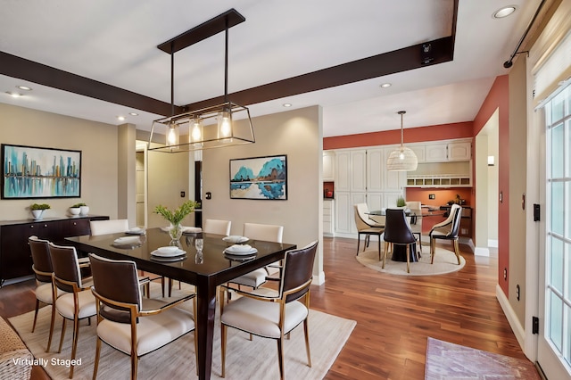 dining space with hardwood / wood-style floors